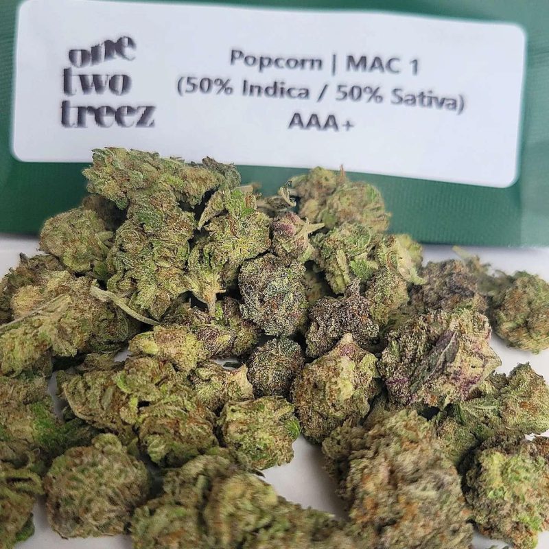 Mac 1. Size you expect for popcorn buds, couldn't complain there. Its appearance is pretty light green, with little hints of pink, purple going throughout the buds, with decent amount trichome coverage. Overall density was decent pretty solid popcorn nugs, trim was good to had a little leaf here and there. Gets a aroma of spicy herb, diesel and a heavy pungent overtone. Sour diesel flavor with a spicy herbal overtone that's accented by sweet citrus.